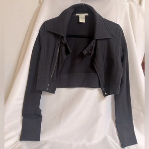 Hot Kiss size L cropped motto jacket. Black with antiqued brass zipper & buckle.